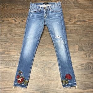 Embroidered skinny distressed jeans